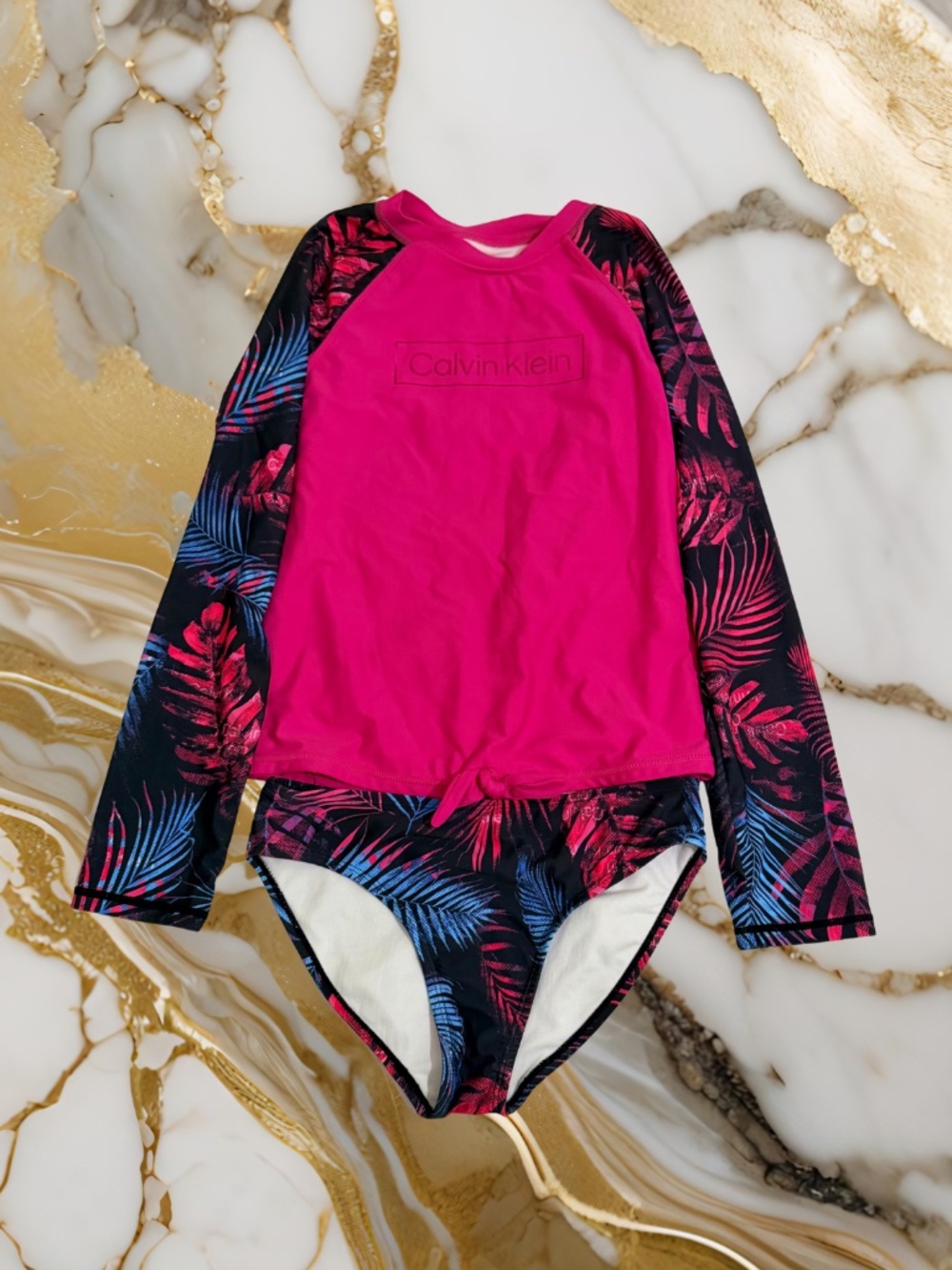 Girls Calvin Klein pink and black two piece swimsuit with blue palm tree leaves